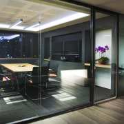 Glass-walled meeting rooms in the M Moser office floor, flooring, glass, interior design, real estate, window, black