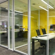 Furniture and blinds offer vibrant pops of colour door, glass, interior design, office, window, gray