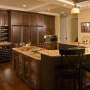 This spacious entertainers kitchen designed by Richard Landon cabinetry, countertop, cuisine classique, flooring, hardwood, interior design, kitchen, room, wood flooring, brown