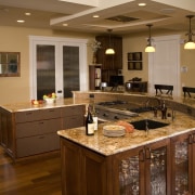 Hardwearing surfaces were on the clients list of cabinetry, countertop, cuisine classique, floor, flooring, hardwood, interior design, kitchen, living room, room, wood flooring, brown