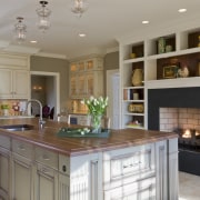 A large, multifunctional island is the centerpiece of cabinetry, countertop, cuisine classique, interior design, kitchen, room, gray, brown