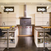 This kitchen is a picture of symmetry  cabinetry, countertop, cuisine classique, floor, flooring, hardwood, interior design, kitchen, laminate flooring, room, wood flooring, white, brown