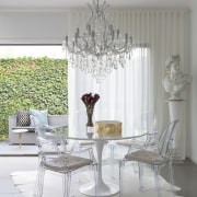 This classic-meets-modern interior is by Massimo Speroni chair, chandelier, dining room, furniture, home, interior design, light fixture, living room, room, table, window, gray, white