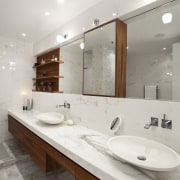 Walnut shelving and cabinetry provide a warm contrast bathroom, countertop, floor, home, interior design, room, sink, tap, white