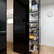 Black glass forms the sides of the cabinets cabinetry, floor, interior design, shelf, shelving, black, white