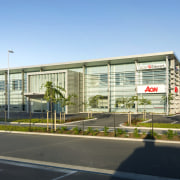 AON Office showcase and home for builder Calder building, commercial building, condominium, corporate headquarters, elevation, headquarters, mixed use, property, real estate, residential area, teal