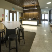 AON Office showcase and home for builder Calder floor, flooring, interior design, lobby, real estate, brown