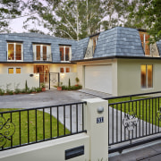 Tucked beneath a towering gum tree canopy, this cottage, estate, facade, home, house, property, real estate, residential area, gray