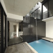 This plunge pool on the second level of apartment, architecture, ceiling, daylighting, estate, floor, glass, house, interior design, property, real estate, window, gray, black
