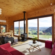 Cedar cladding wraps the exterior of this Lockwood ceiling, estate, home, house, interior design, living room, real estate, room, window, wood, brown