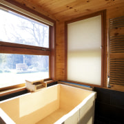 Cedar cladding wraps the exterior of this Lockwood architecture, ceiling, daylighting, floor, home, house, interior design, real estate, room, table, window, wood, brown