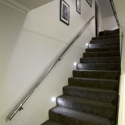 Design and build by Fowler Homes Taranaki - daylighting, handrail, stairs, gray