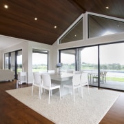 The house features a mix of solid oak architecture, ceiling, daylighting, floor, flooring, hardwood, home, house, interior design, living room, real estate, table, window, wood, wood flooring, brown, white