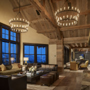 The living spaces in this mountain home feature ceiling, estate, interior design, living room, brown
