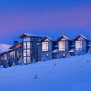 Gabled roofs and weatherboards abound in this Montana alps, arctic, atmosphere, blue, building, cloud, evening, freezing, home, house, light, log cabin, morning, mountain, mountain range, real estate, sky, snow, winter, blue