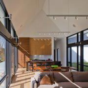 Clapboard siding and a metal roof place this architecture, ceiling, daylighting, estate, home, house, interior design, living room, real estate, gray, brown