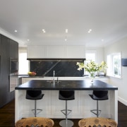 This classic kitchen by Robyn Labb offers modern architecture, ceiling, countertop, floor, flooring, hardwood, home, house, interior design, kitchen, living room, real estate, room, table, wood flooring, gray