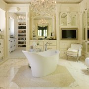 In a break with convention, this room is bathroom, cuisine classique, estate, floor, flooring, home, interior design, room, tile, orange, gray