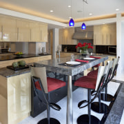 A raised granite breakfast bar screens countertop clutter countertop, cuisine classique, dining room, interior design, kitchen, real estate, room, gray