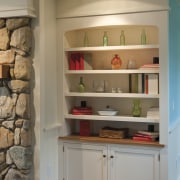 Interior designer Elizabeth Swartz created a built-in dresser bookcase, cabinetry, furniture, hardwood, interior design, shelf, shelving, wall, brown, gray