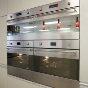 Smeg appliances in Inside Vision kitchen showroom - display case, gas stove, glass, home appliance, kitchen, kitchen appliance, kitchen stove, major appliance, oven, shelving, gray