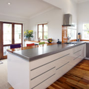 This clean-lined kitchen is by  RH Cabinetmakers cabinetry, countertop, cuisine classique, floor, flooring, hardwood, interior design, kitchen, laminate flooring, real estate, room, wood flooring, gray