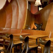 The lounge and dining areas in the Américas chair, flooring, furniture, interior design, restaurant, table, wood, brown