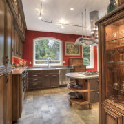 This Richard Landon kitchen has a warm aesthetic cabinetry, ceiling, countertop, cuisine classique, floor, flooring, hardwood, interior design, kitchen, real estate, room, wood flooring, brown, gray