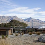 With a slender profile and a pitch that cloud, elevation, home, house, landscape, mountain, mountain range, mountainous landforms, national park, real estate, reflection, sky, tree, water, wilderness, winter