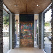 Contrasting textural elements enliven the entry to this architecture, door, home, house, window, black, gray