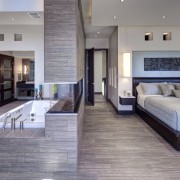 This master suite has been opened up to floor, flooring, interior design, living room, wood flooring, gray