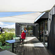 Four containers were linked to create this innovative architecture, canopy, house, real estate, white, black