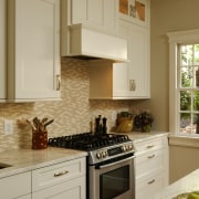 Understated, clean-lined cabinetry panels in this kitchen find cabinetry, countertop, cuisine classique, home, home appliance, interior design, kitchen, room, orange, brown