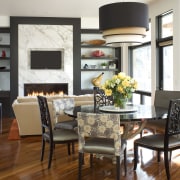 Black frames and polished wood floors provide a dining room, furniture, home, interior design, living room, room, table, white