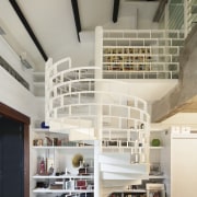 Although most of the interior of this office-apartment architecture, ceiling, daylighting, interior design, loft, shelf, shelving, stairs, gray