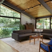 A family living area, positioned at the far architecture, ceiling, daylighting, estate, home, house, interior design, living room, real estate, roof, window, wood