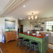 This kitchen blends with its surroundings through architectural ceiling, dining room, floor, flooring, furniture, hardwood, home, house, interior design, kitchen, living room, real estate, room, table, gray, brown