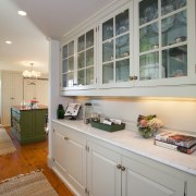 This kitchen blends with its surroundings through architectural cabinetry, countertop, cuisine classique, home, interior design, kitchen, real estate, room, window, gray