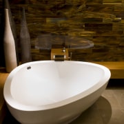 The tortoiseshell glass tiles wrap around two walls bathroom, bathroom sink, bathtub, ceramic, interior design, plumbing fixture, product design, sink, tap, toilet seat, brown