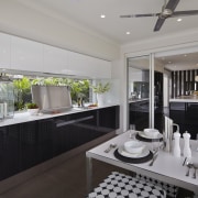 Alfresco dining is set off the kitchen area countertop, interior design, kitchen, property, real estate, window, gray, black