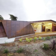 This modern addition to an older home in architecture, cottage, facade, home, house, hut, property, real estate, roof, shed, wood, white