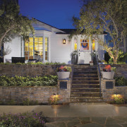 This beachside bungalow has undergone a major transformation architecture, backyard, cottage, estate, facade, home, house, landscape, landscaping, lighting, neighbourhood, outdoor structure, property, real estate, residential area, villa, brown