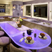 Glass benchtops illuminated with violet lighting ensure this countertop, interior design, kitchen, purple, room, brown