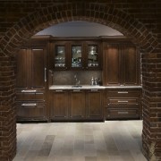 At the rear, the new basement terrace level cabinetry, wood, wood stain, brown, black