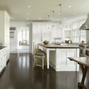 Built in 1912, this house has more than cabinetry, countertop, cuisine classique, floor, flooring, interior design, kitchen, room, white