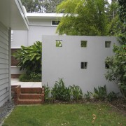 This area of grass was transformed by pavers backyard, cottage, courtyard, facade, garden, grass, home, house, outdoor structure, plant, property, real estate, shed, siding, window, yard, gray, brown