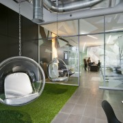 A multifaceted facade behind the reception desk of interior design, product design, gray