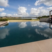 Entertainers delight  a major renovation to this cloud, real estate, reflection, sky, swimming pool, water, water resources, waterway, gray