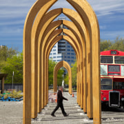 The Arcades is a collaboration between Ryan Reynolds, arch, architecture, sky, structure, wood, gray