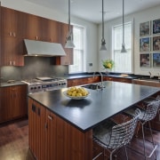 Crisp simplicity defines this contemporary kitchen in an cabinetry, countertop, cuisine classique, hardwood, interior design, kitchen, real estate, room, gray